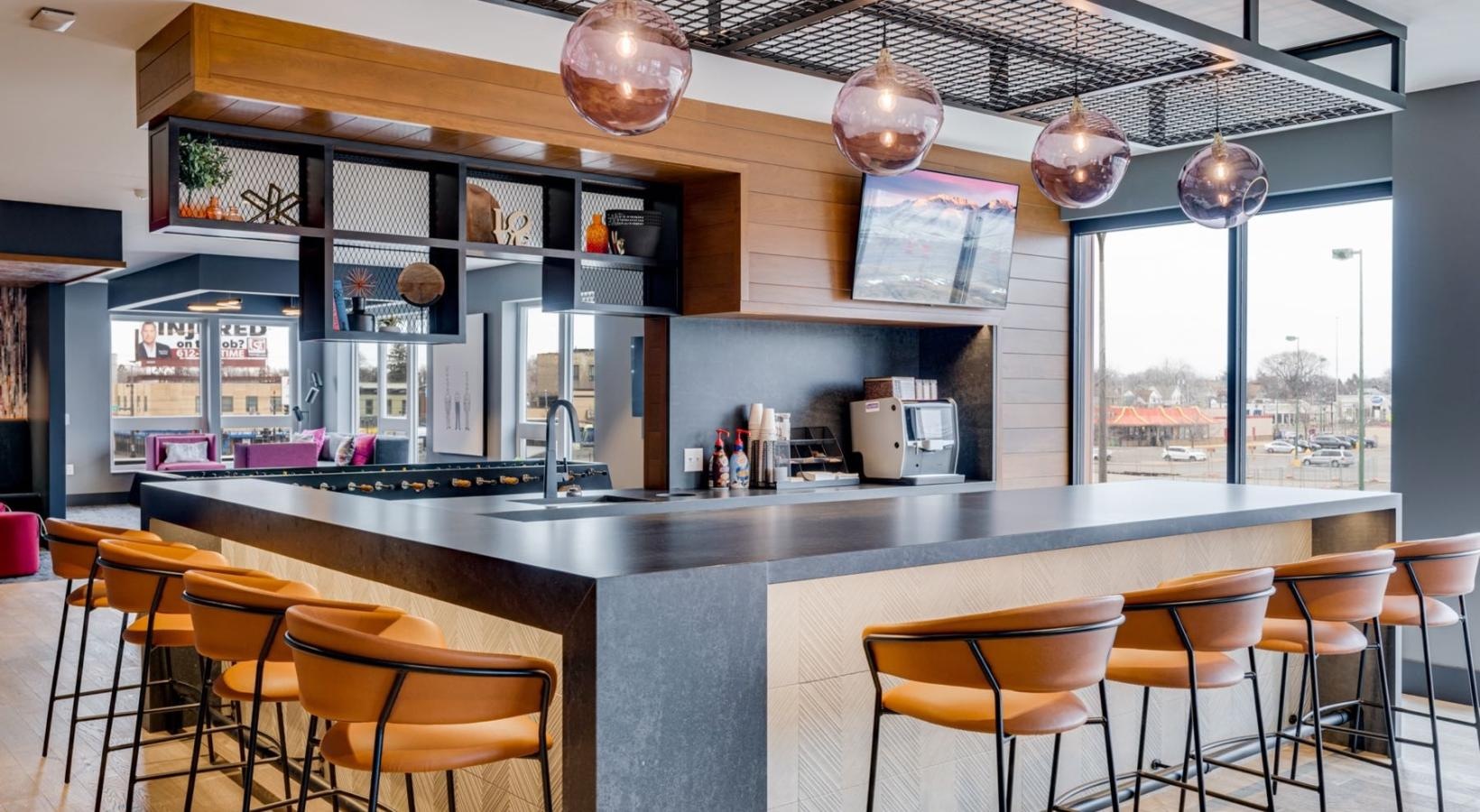 Everything within reach a bar with a bar and chairs