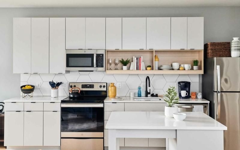 a kitchen with white cabinets