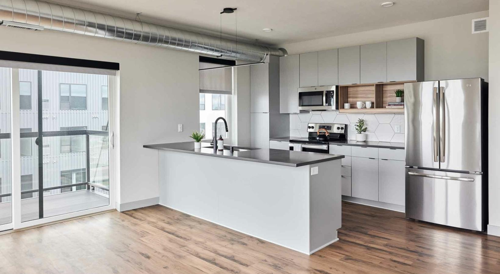 Spacious kitchens with thoughtful details a kitchen with white cabinets