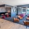 a room with a fireplace and chairs