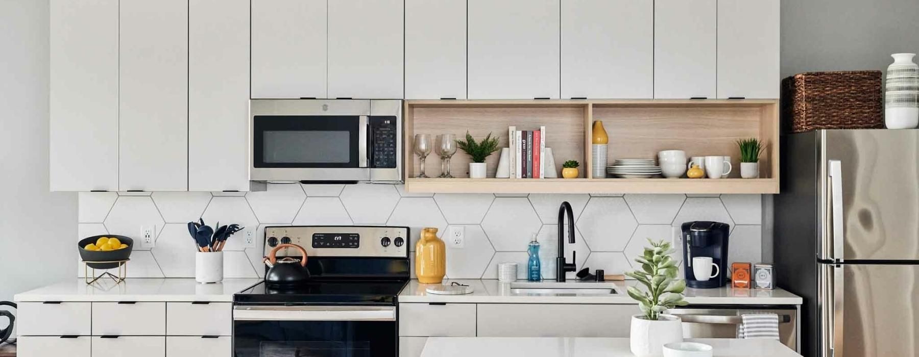 a kitchen with white cabinets