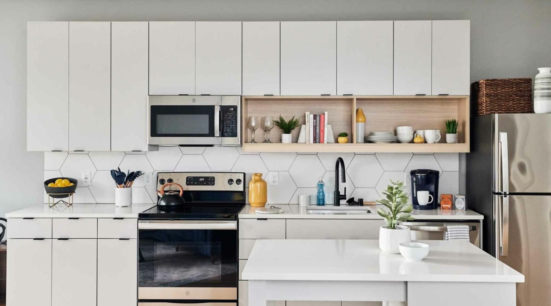a kitchen with white cabinets
