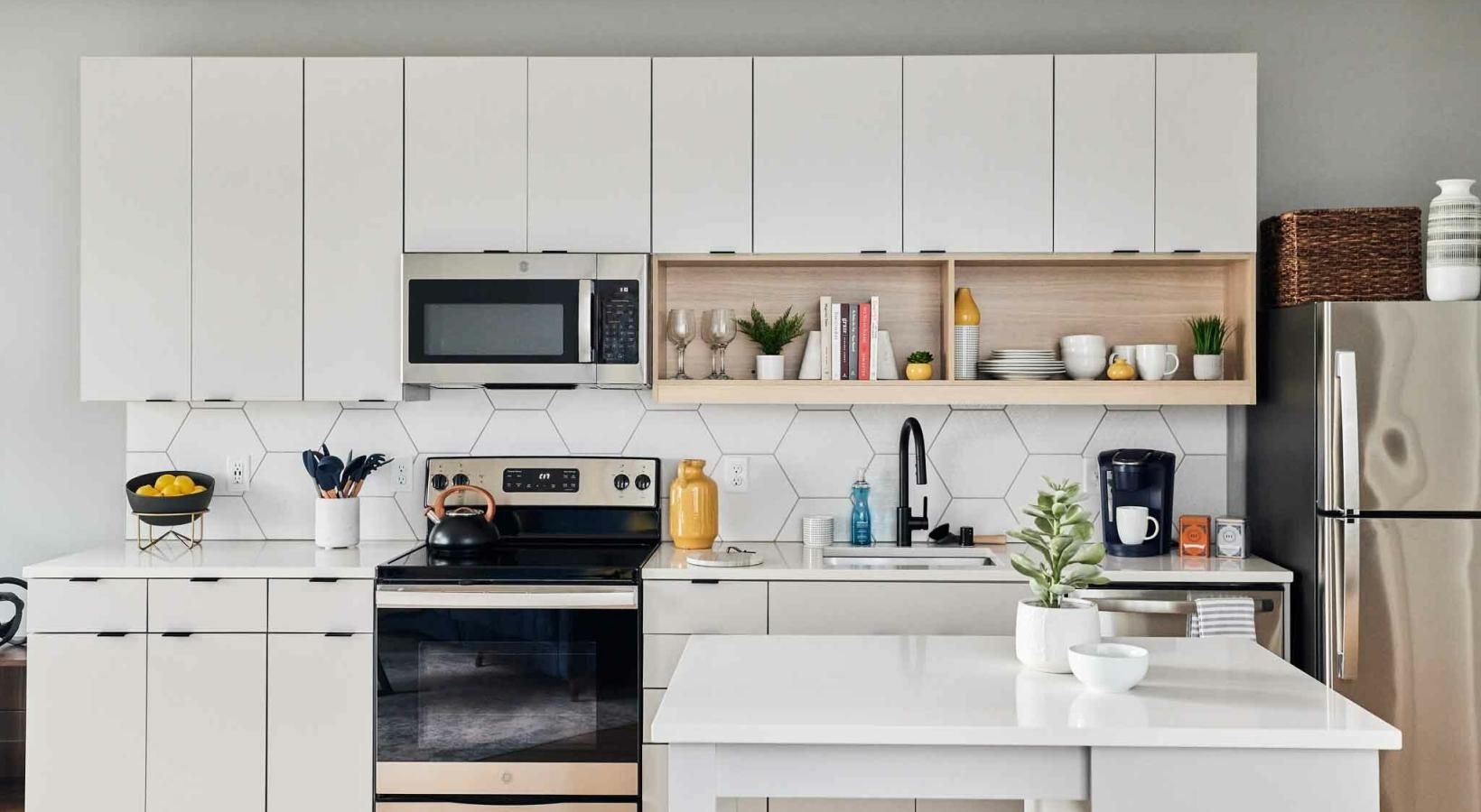 Spacious kitchens with thoughtful details a kitchen with white cabinets
