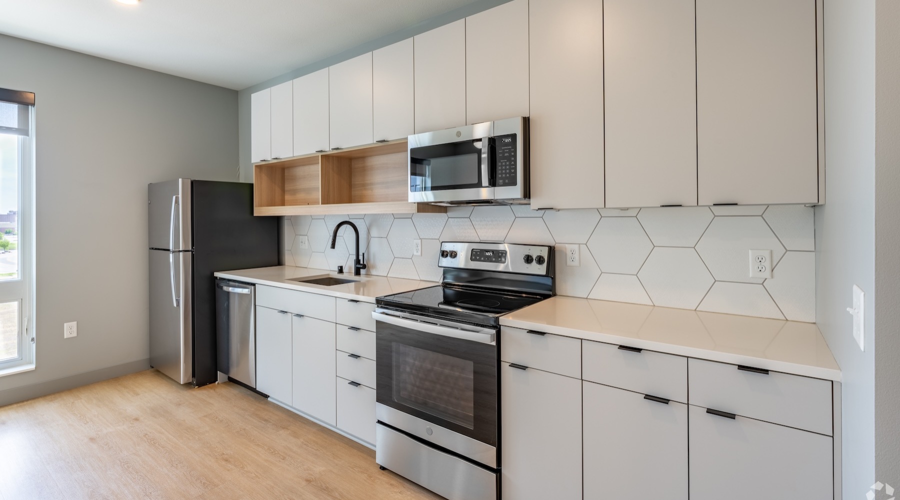 Styled kitchen with white modern cabinets