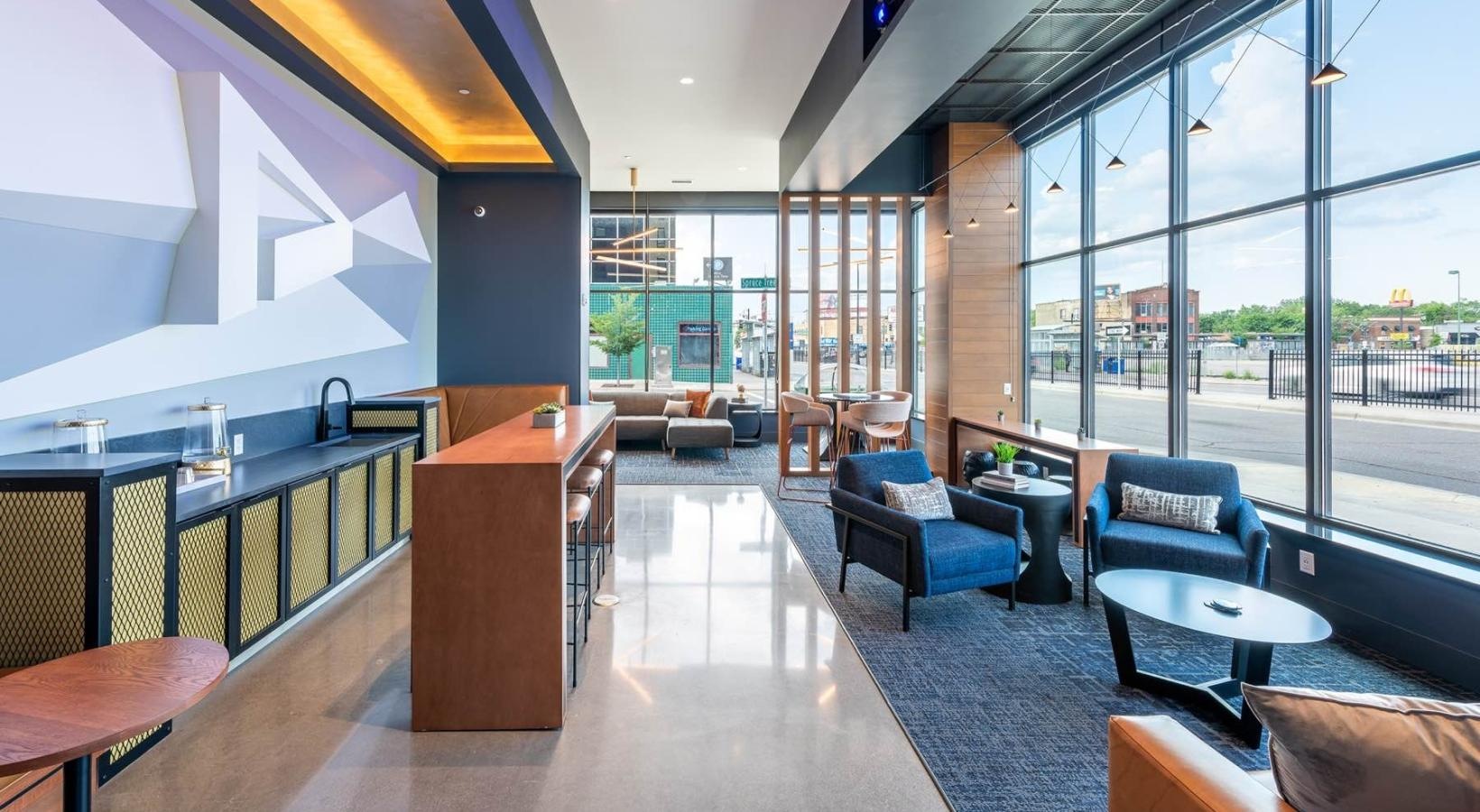 Enjoy our resident-only features a room with a large glass wall and a large window