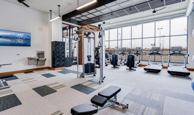 Cutting-edge amenities at your fingertips a gym with exercise equipment
