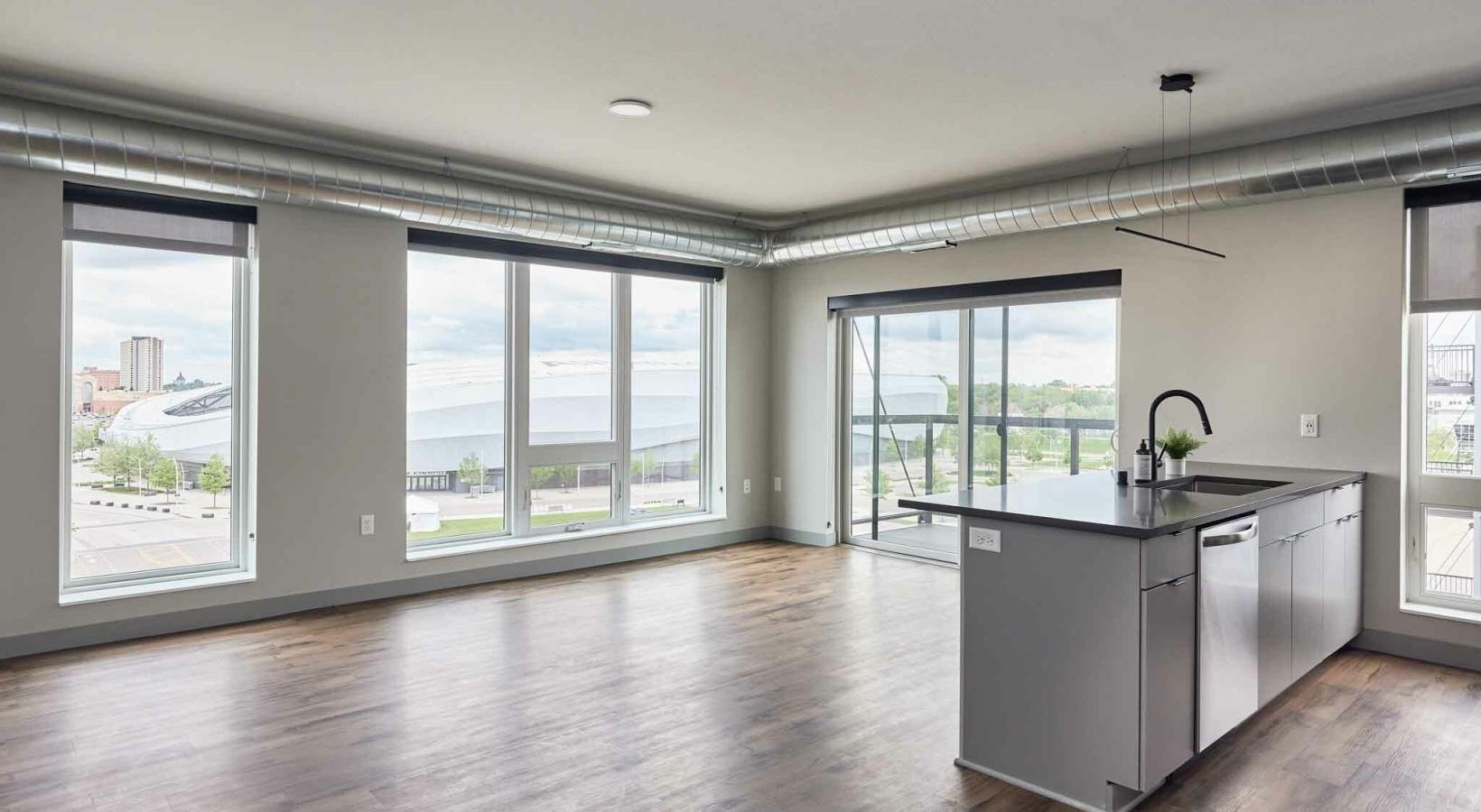 Relax and unwind in well-lit living areas a kitchen with large windows