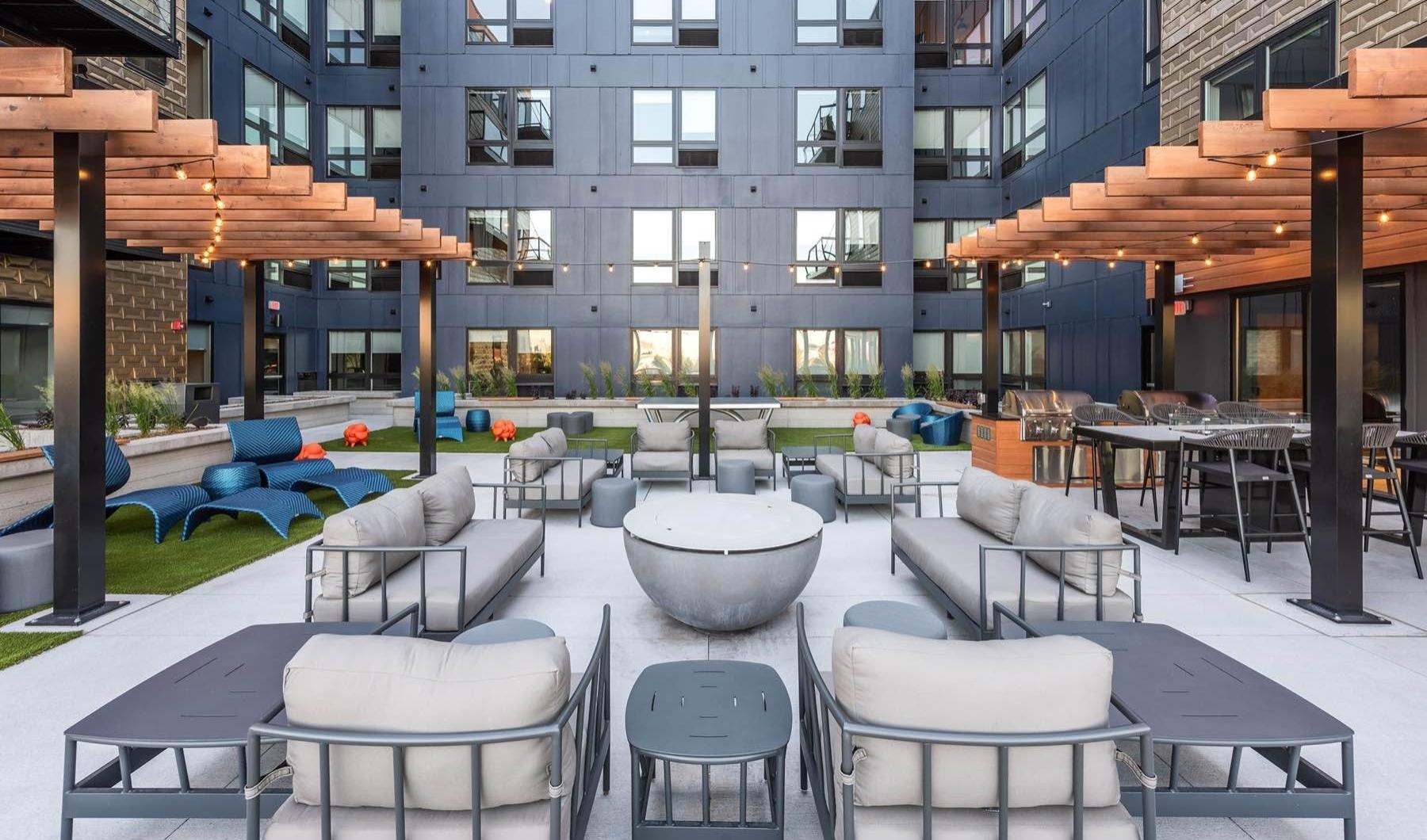 a group of tables and chairs outside a building